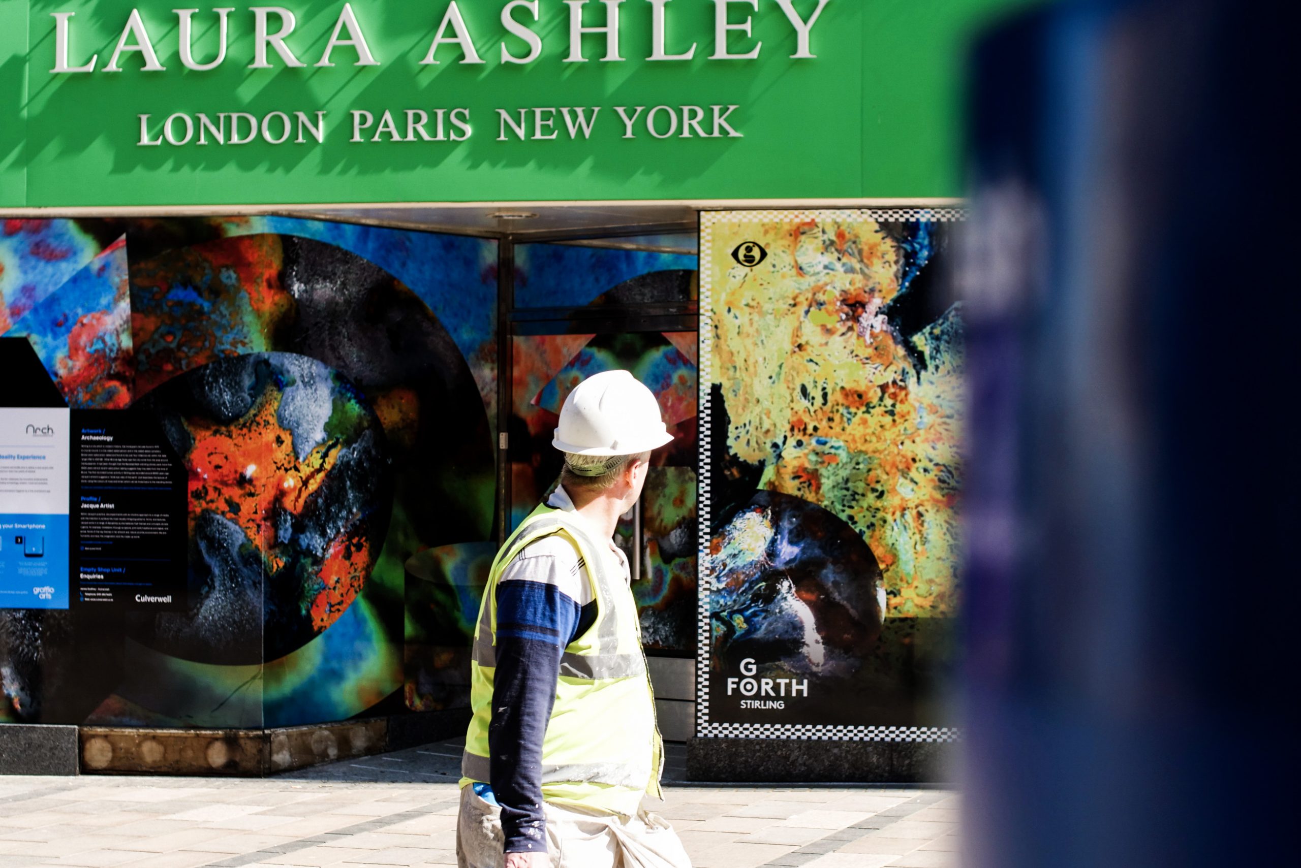 a construction worker taking in one of the art installations for Street Stories Stirling
