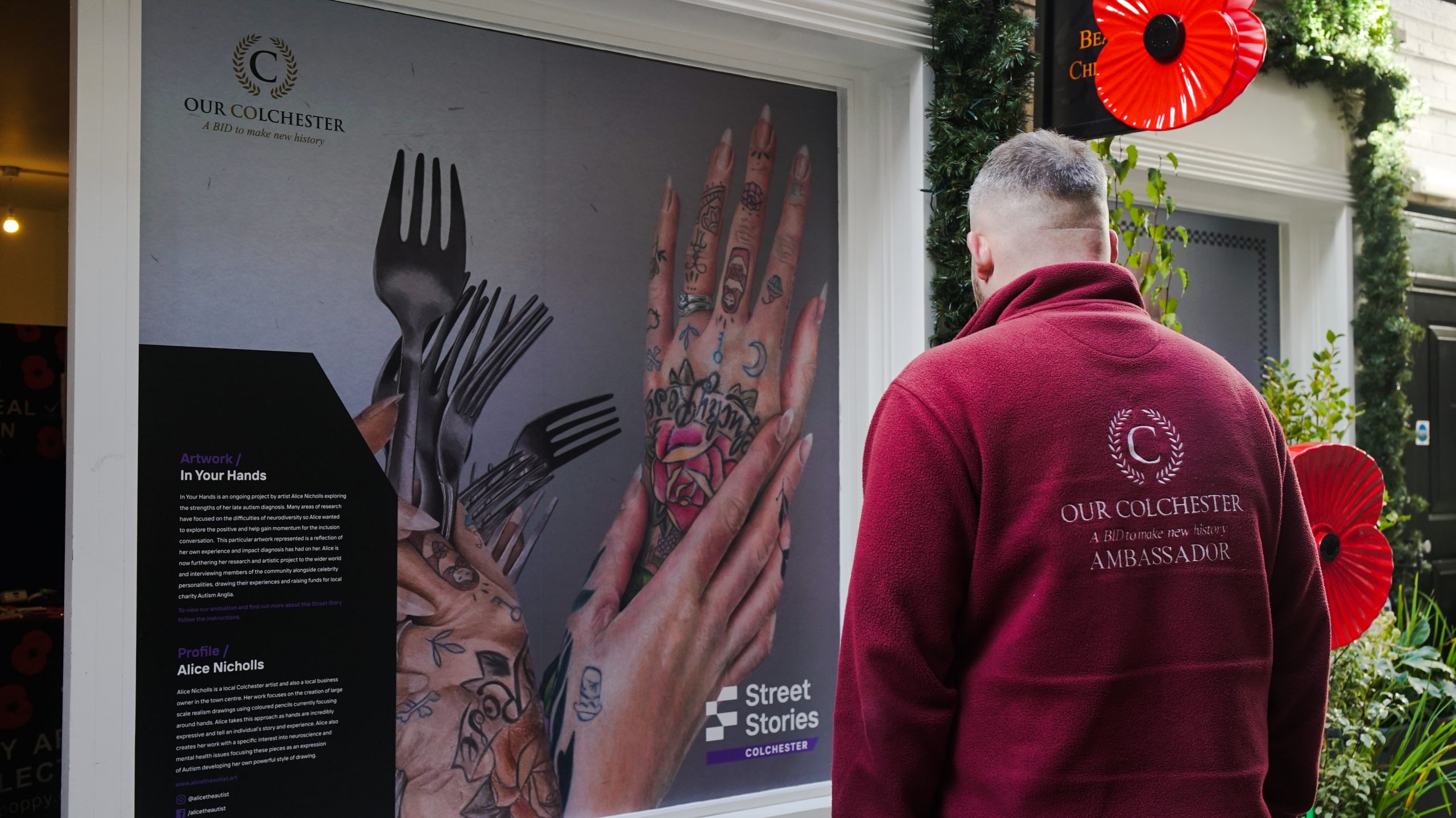 An ambassador of Our Colchester viewing artist Alice Nicholls' contribution to the AR art trail